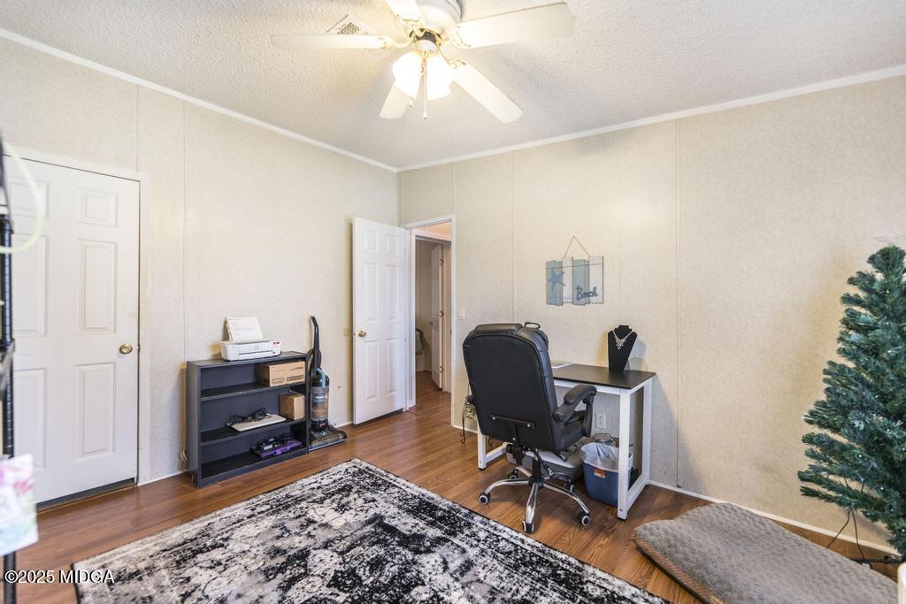 100 Coventry Manor Court Byron, GA 31008 - Photo 23 of 29 a view of a workspace with furniture and a bedroom