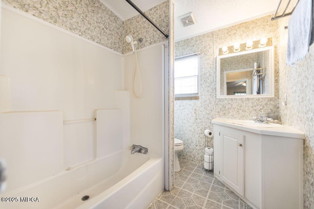 100 Coventry Manor Court Byron, GA 31008 - Photo 24 of 29 a bathroom with a sink a toilet and shower