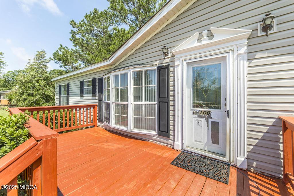 100 Coventry Manor Court Byron, GA 31008 - Photo 7 of 29 a view of a house with wooden floor and a yard