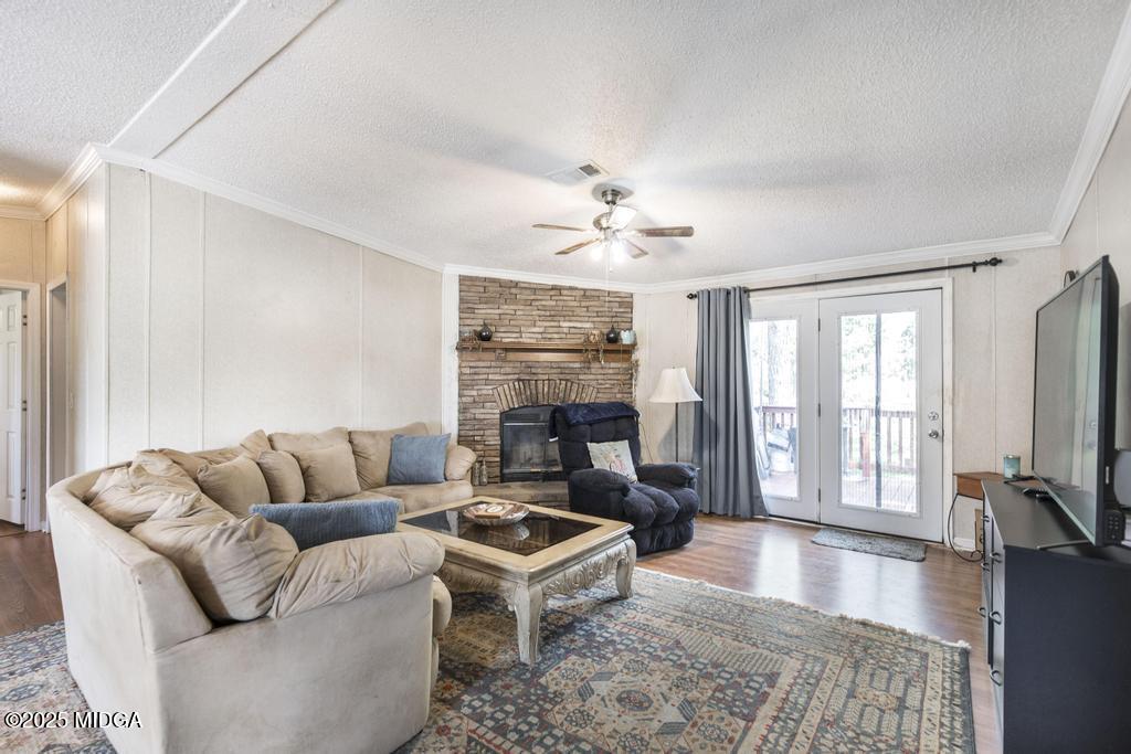 100 Coventry Manor Court Byron, GA 31008 - Photo 8 of 29 a living room with furniture flat screen tv and a fireplace