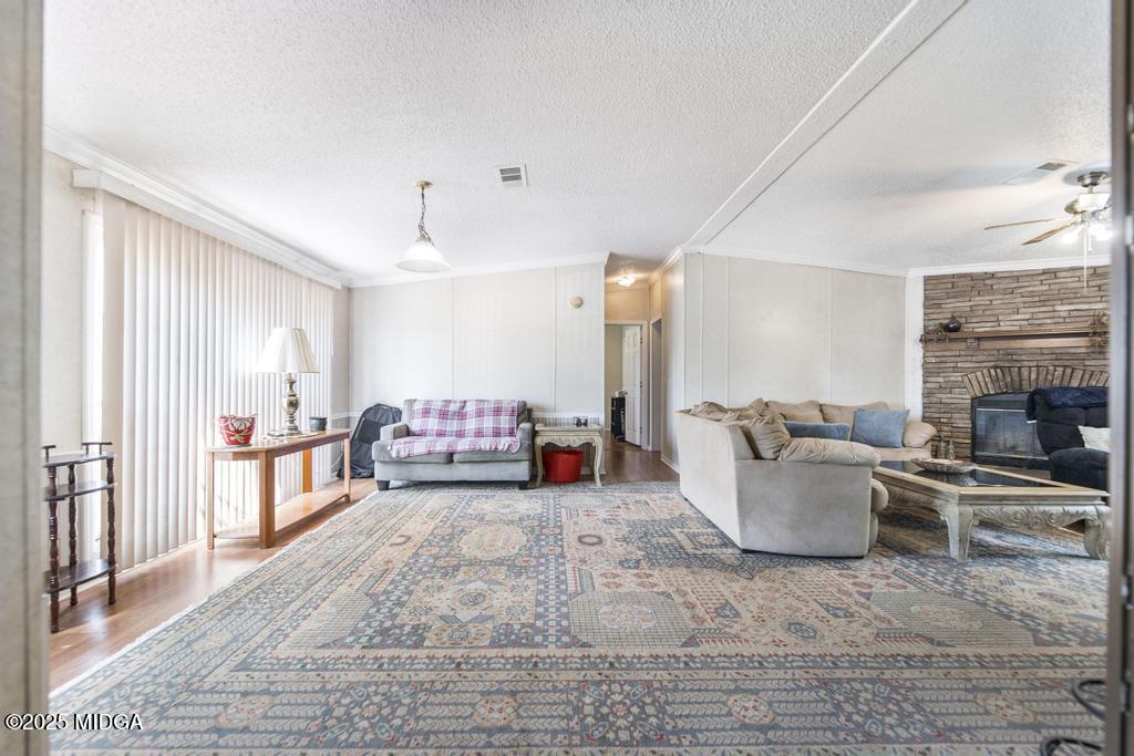 100 Coventry Manor Court Byron, GA 31008 - Photo 10 of 29 a living room with furniture and a fireplace
