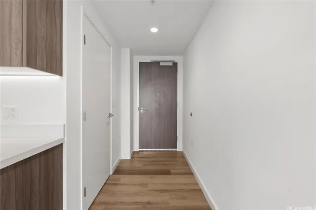 a view of a hallway with washer and dryer
