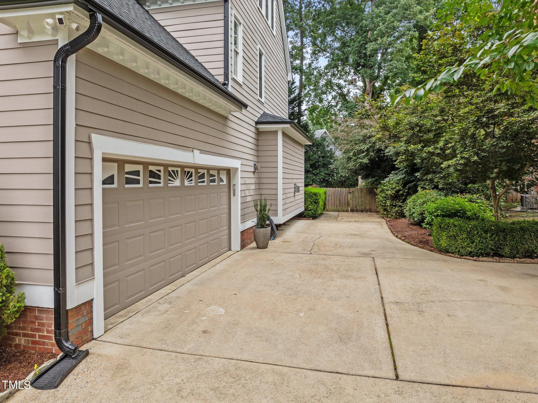 8708 Aldersgate Way Raleigh, NC 27615 - Photo 54 of 58 a front view of a house with a garage