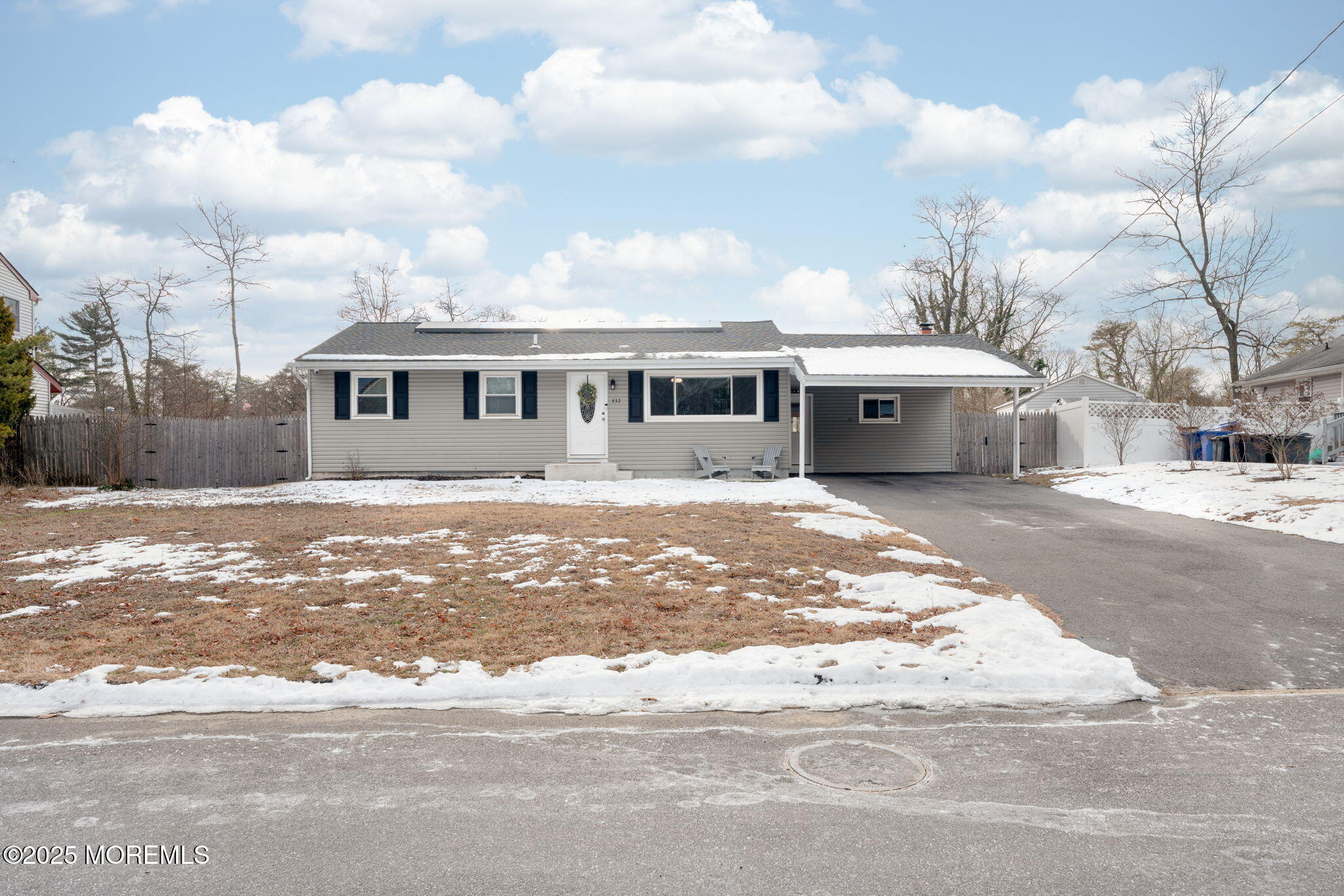 a view of a house with a snow on the road