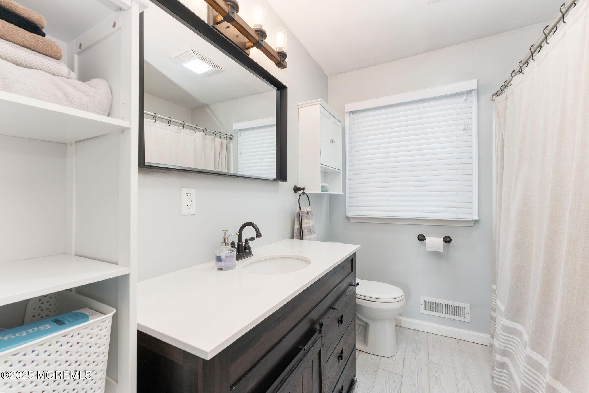 332 Maple Road Mount Laurel, NJ 08054 - Photo 16 of 21 a bathroom with a sink a toilet and a mirror