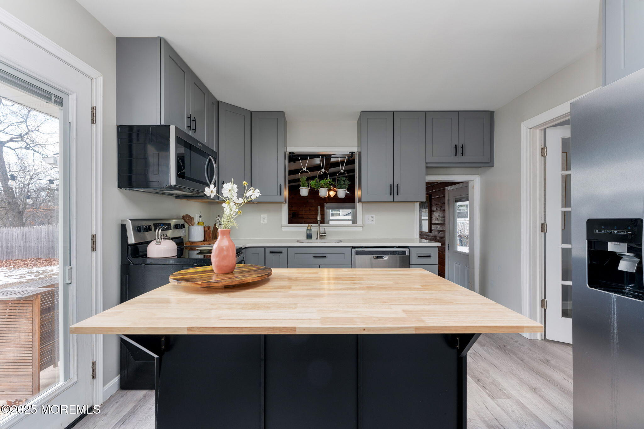 332 Maple Road Mount Laurel, NJ 08054 - Photo 9 of 21 a kitchen with kitchen island a sink refrigerator and wooden cabinets