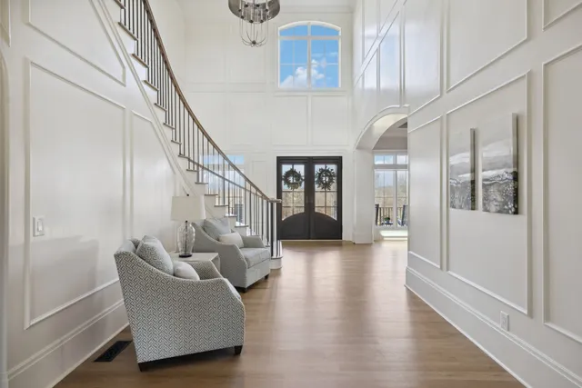 a living room with fireplace furniture and a fireplace