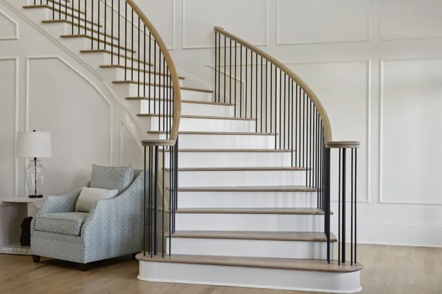 a view of a patio with a table and chairs and floor to ceiling window