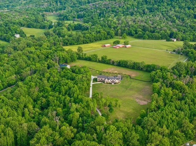 a kitchen with granite countertop a stove and a sink