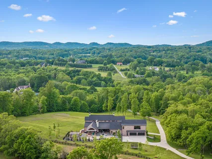a bedroom with furniture and a flat screen tv