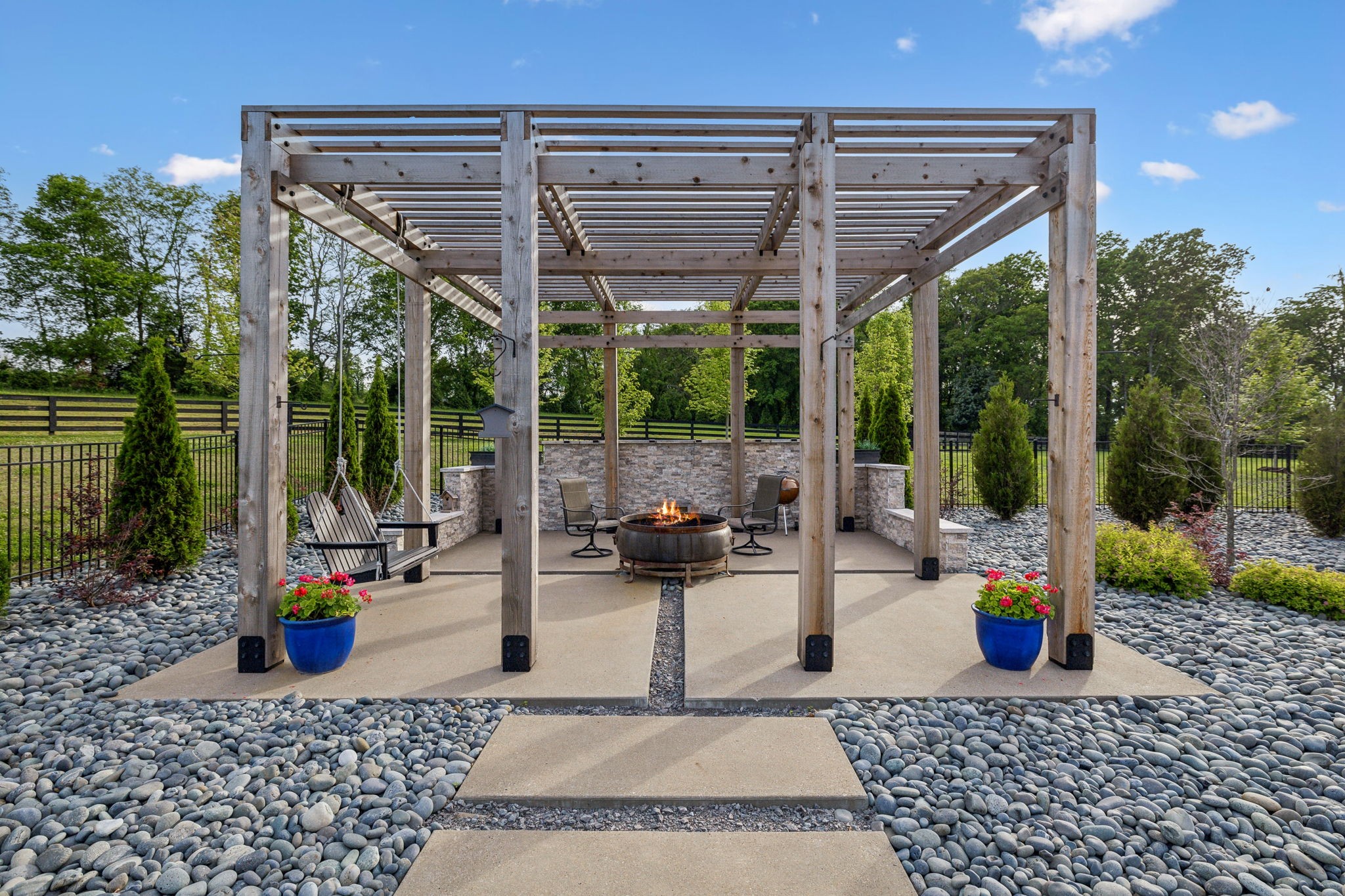 6599 Owen Hill Road College Grove, TN 37046 - Photo 51 of 65 a view of a patio with a table and chairs and floor to ceiling window