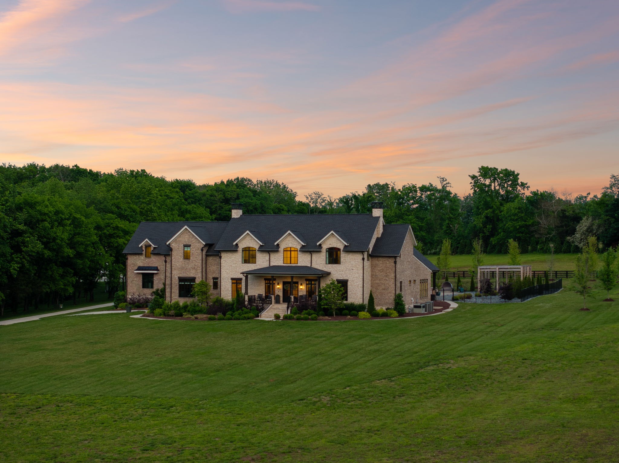6599 Owen Hill Road College Grove, TN 37046 - Photo 62 of 65 a view of a white house with a big yard and large trees