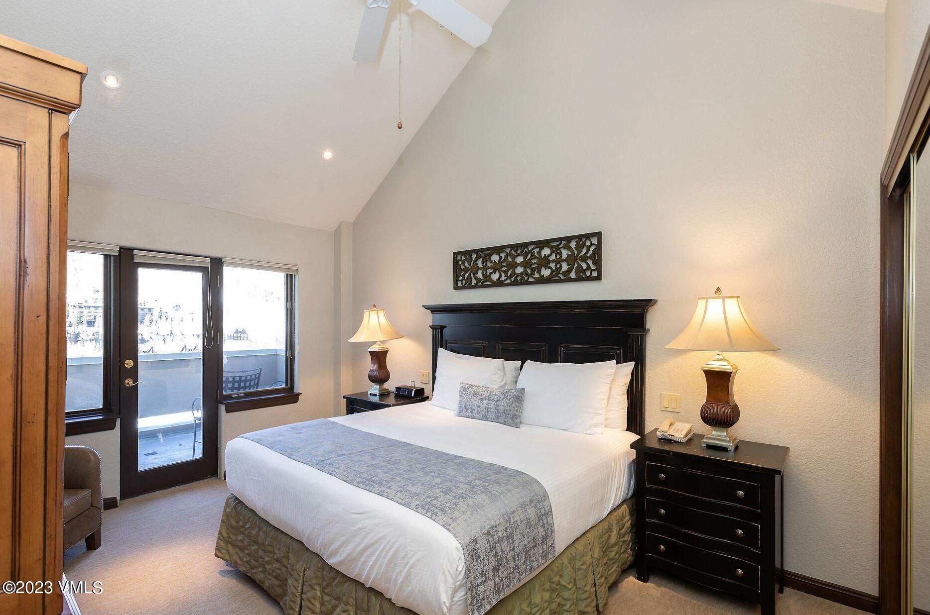 210 Offerson Road, Unit R408 WEEK 34 Beaver Creek, CO 81620 - Photo 19 of 28 a bedroom with a bed and wooden floor