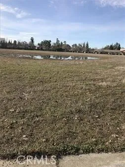 a view of a lake with houses in the back