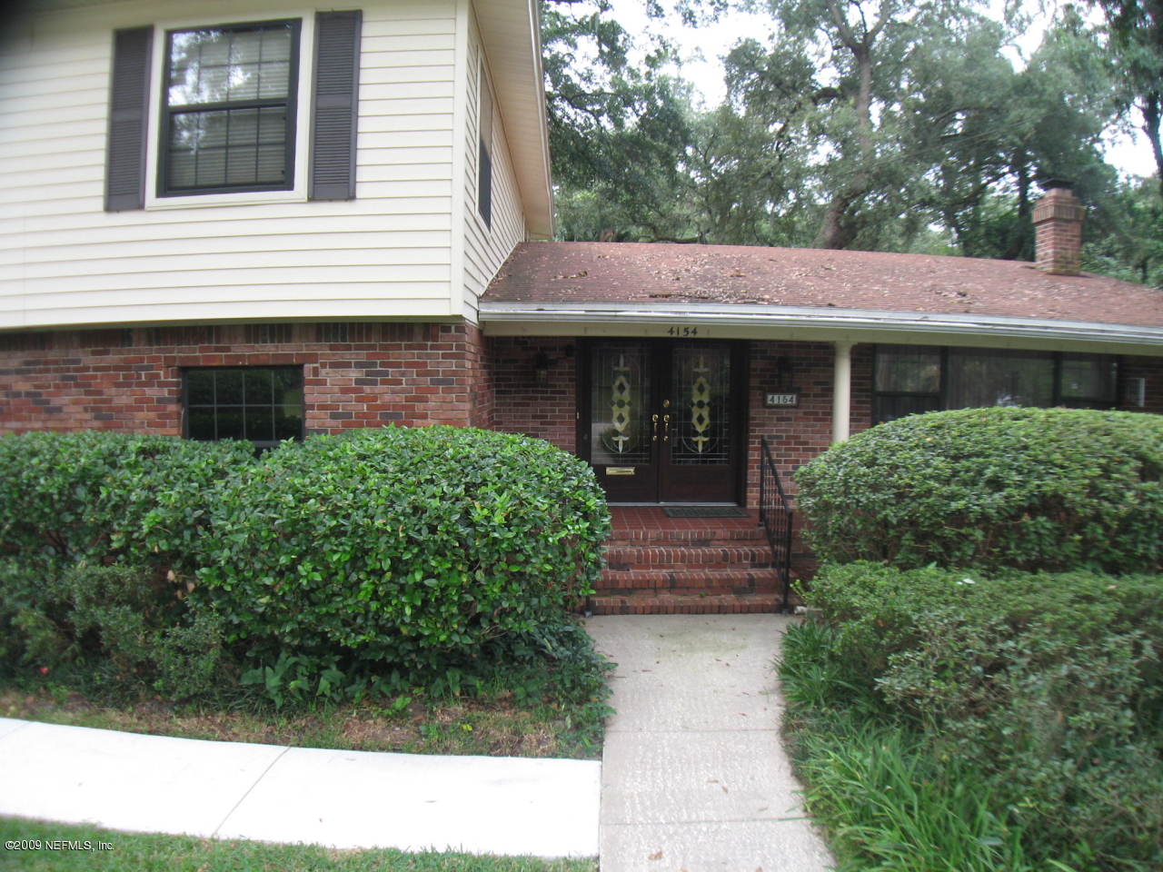 4154 Rogero Road Jacksonville, FL 32277 - Photo 3 of 31 a view of a house with a yard
