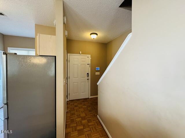 2027 Turtle Point Drive Raleigh, NC 27604 - Photo 3 of 18 a view of a hallway with a refrigerator