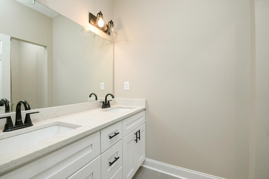5342 Monarch Drive Gainesville, GA 30506 - Photo 17 of 27 a bathroom with a sink and a mirror