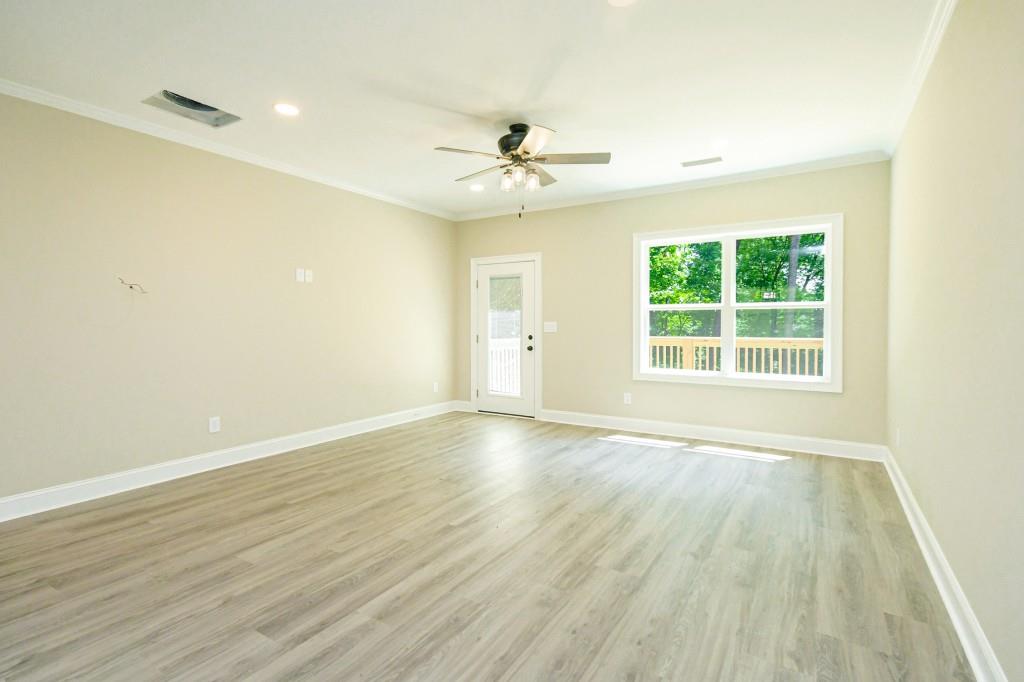 5342 Monarch Drive Gainesville, GA 30506 - Photo 7 of 27 wooden floor in an empty room with a window