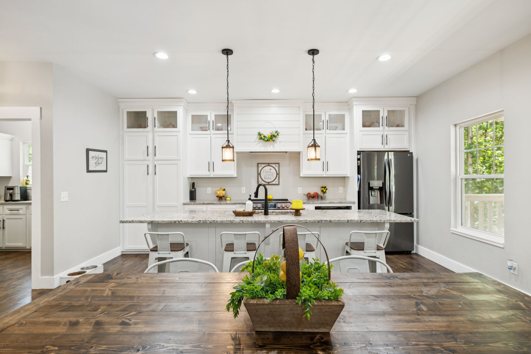 977 Elzie Williams Road Red Boiling Springs, TN 37150 - Photo 16 of 52 a view of a kitchen with kitchen island stainless steel appliances wooden floor and chair
