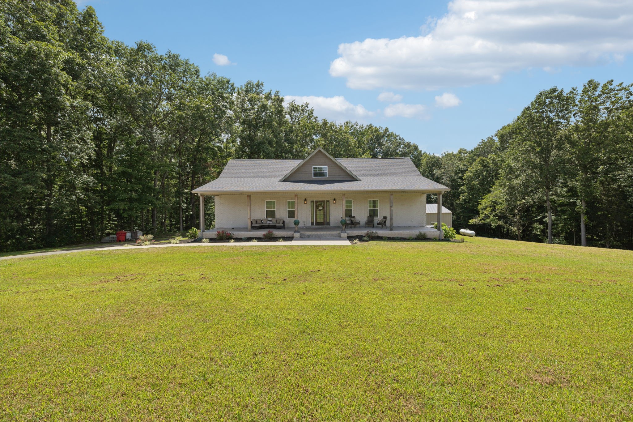 977 Elzie Williams Road Red Boiling Springs, TN 37150 - Photo 2 of 52 a front view of house with swimming pool and green space