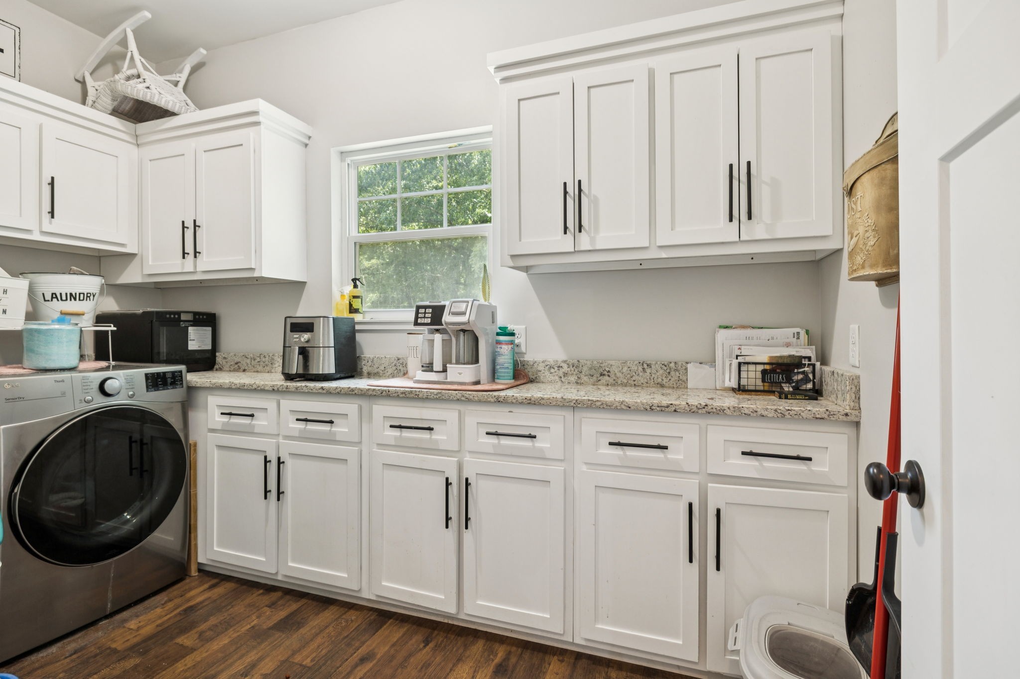 977 Elzie Williams Road Red Boiling Springs, TN 37150 - Photo 23 of 52 a kitchen with white cabinets and white appliances