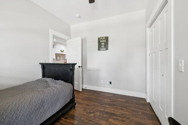 a bedroom with furniture and a window