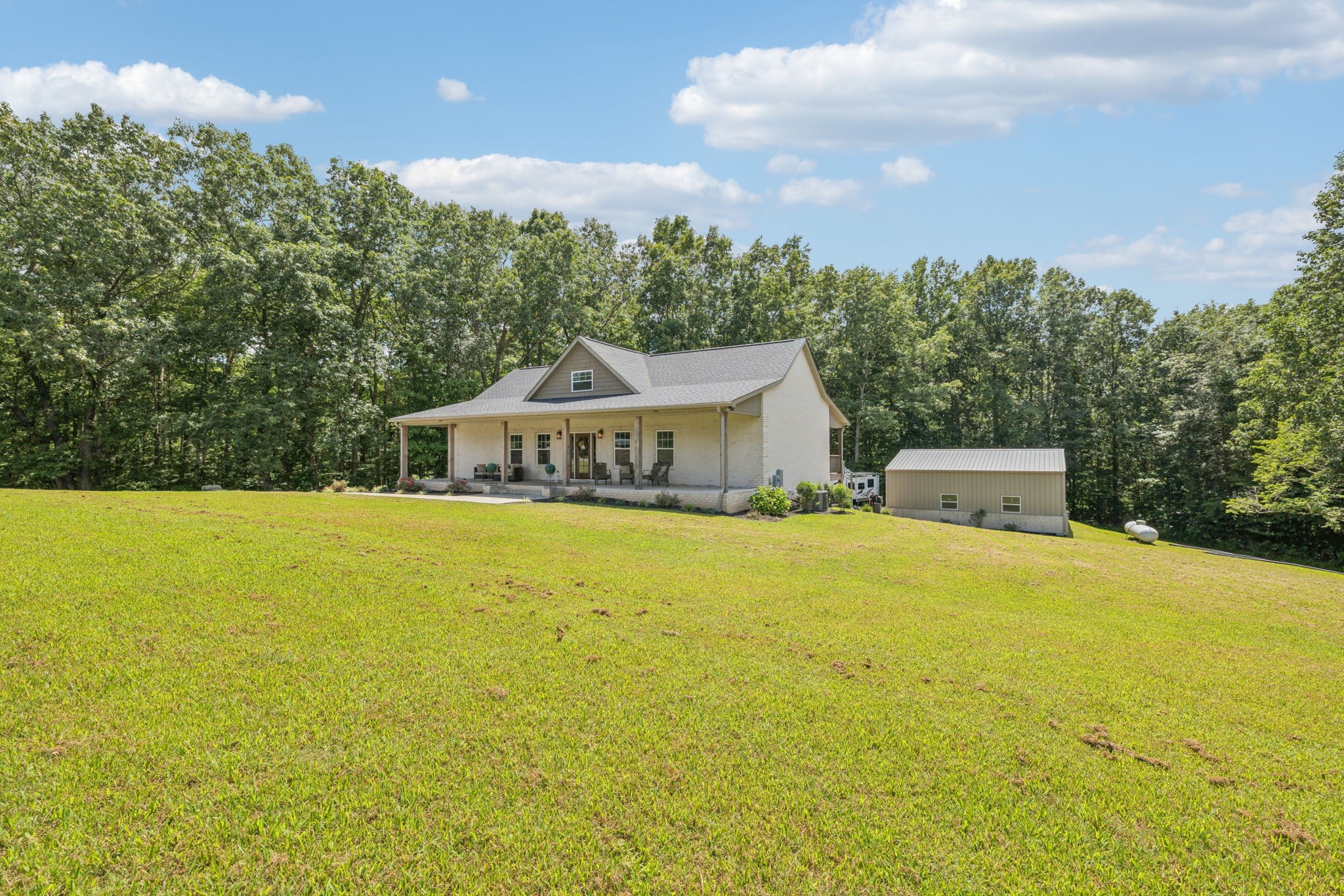 977 Elzie Williams Road Red Boiling Springs, TN 37150 - Photo 3 of 52 a front view of a house with a yard