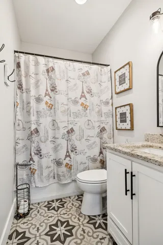 a bed room with a bed and a television