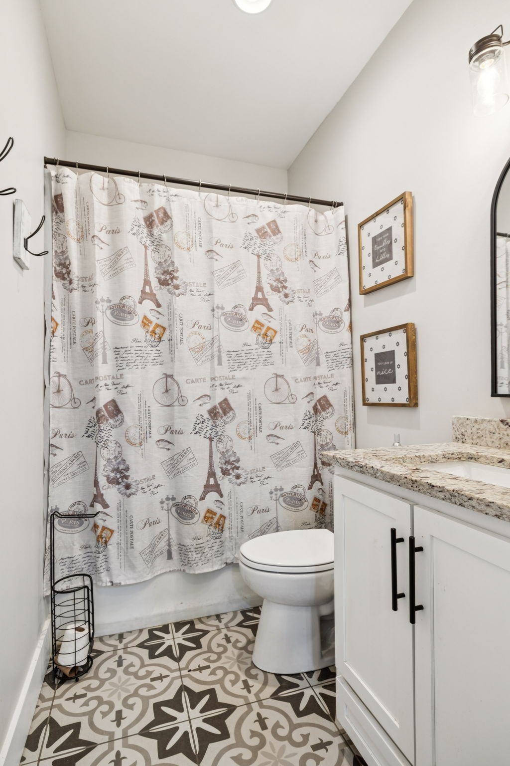 977 Elzie Williams Road Red Boiling Springs, TN 37150 - Photo 32 of 52 a bathroom with a granite countertop toilet a sink and a shower