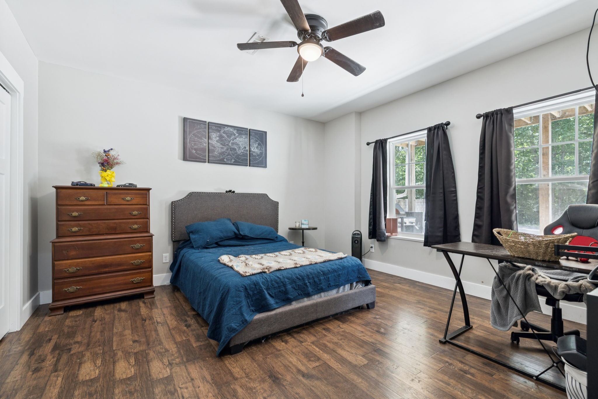 977 Elzie Williams Road Red Boiling Springs, TN 37150 - Photo 34 of 52 a bedroom with a bed and wooden floor