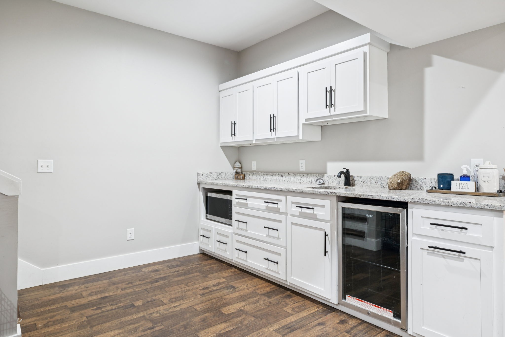 977 Elzie Williams Road Red Boiling Springs, TN 37150 - Photo 36 of 52 a kitchen with granite countertop white cabinets and white appliances