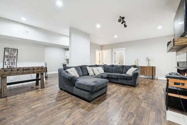 a living room with furniture and a fireplace