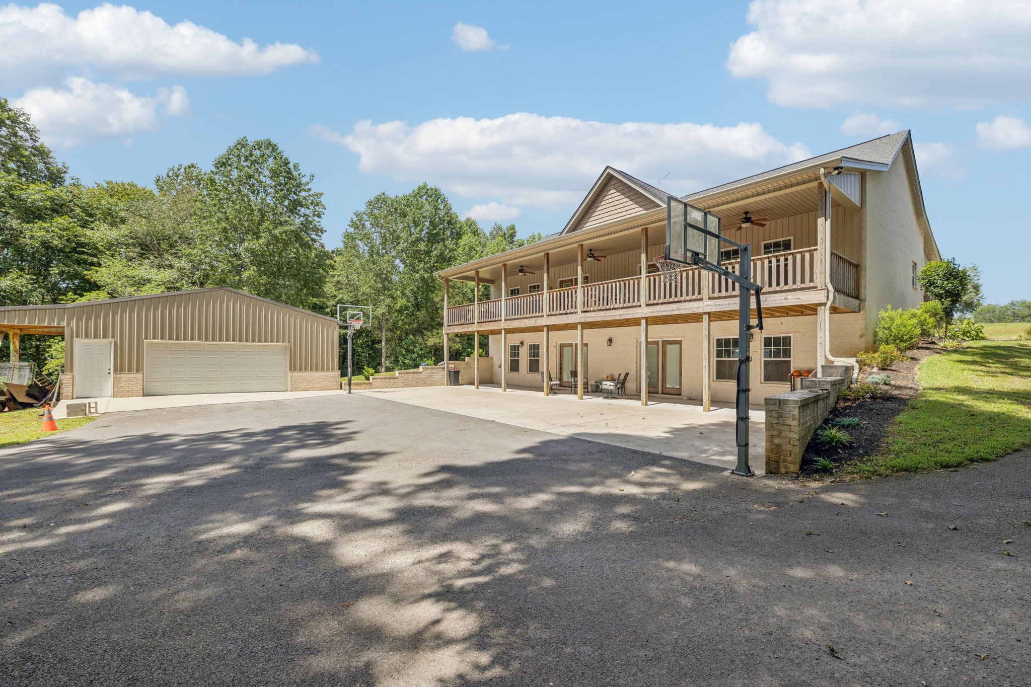 977 Elzie Williams Road Red Boiling Springs, TN 37150 - Photo 48 of 52 a view of a house with backyard and a parking space