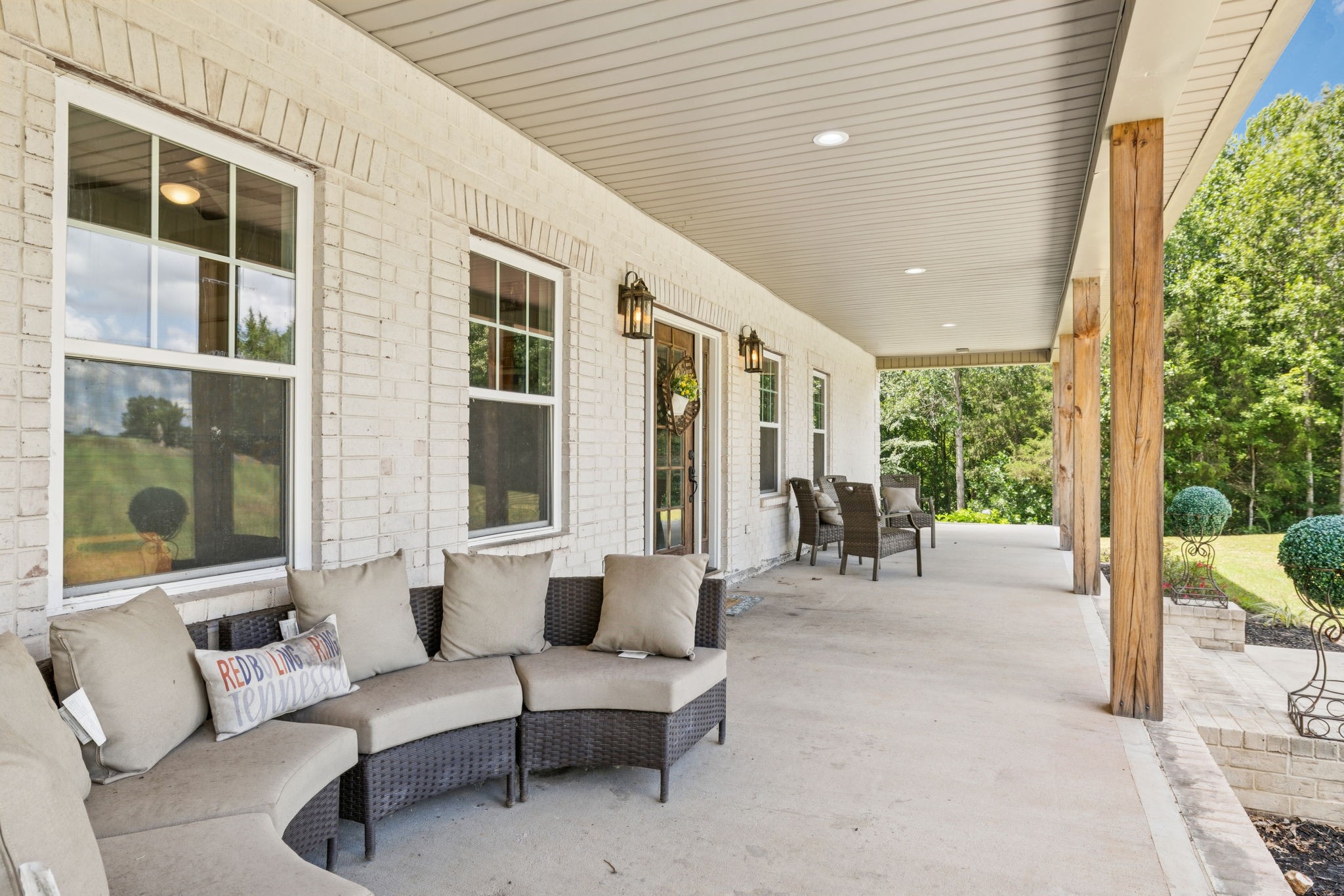 977 Elzie Williams Road Red Boiling Springs, TN 37150 - Photo 8 of 52 a outdoor space with patio the couches and a dining table with garden view