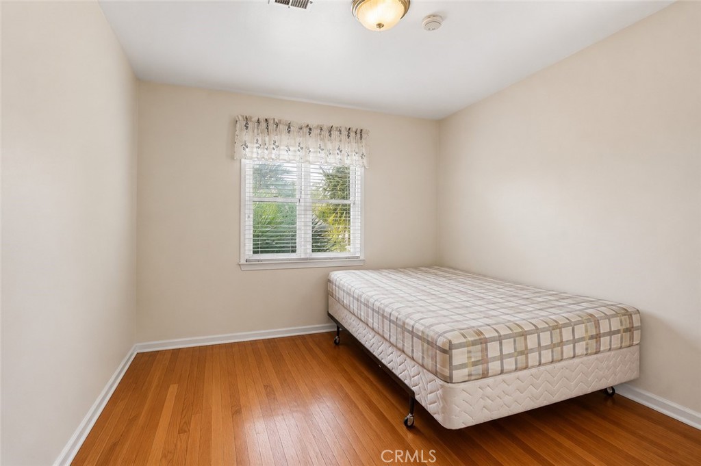 2209 Queensberry Road Pasadena, CA 91104 - Photo 23 of 44 a bedroom with a bed and window