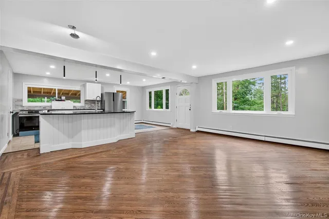 a view of kitchen with wooden floor