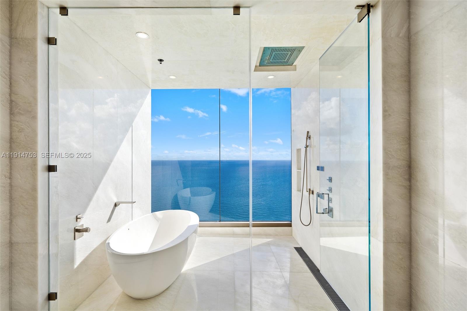 17901 Collins Avenue, Unit 4507 Sunny Isles Beach, FL 33160 - Photo 12 of 58 a bathroom with a tub and shower