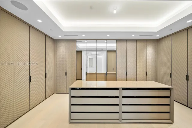 a bathroom with a shower and a glass door