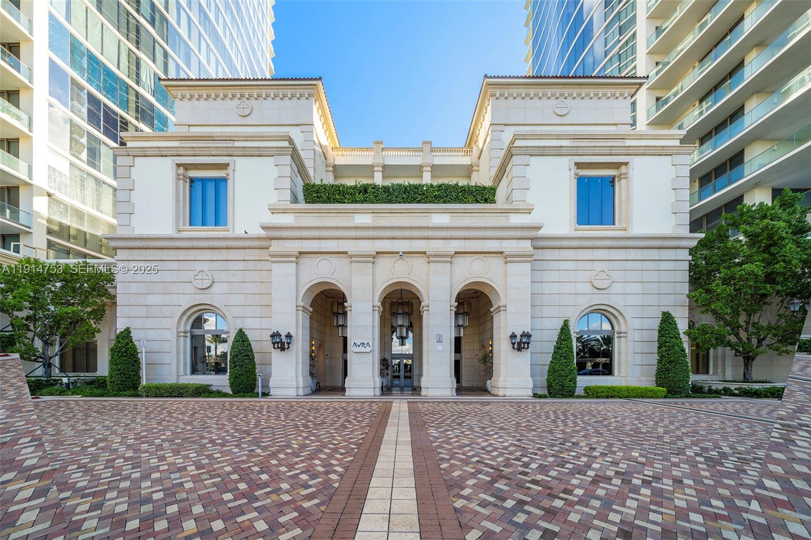 17901 Collins Avenue, Unit 4507 Sunny Isles Beach, FL 33160 - Photo 26 of 58 a view of a white house with large windows and potted plants