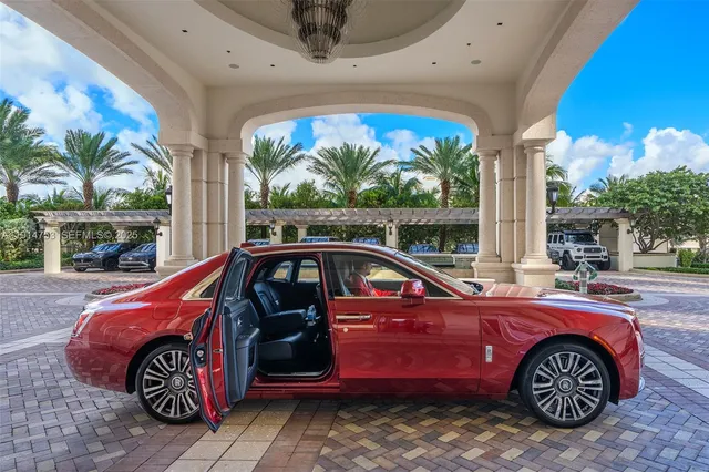 a lobby with furniture and large windows