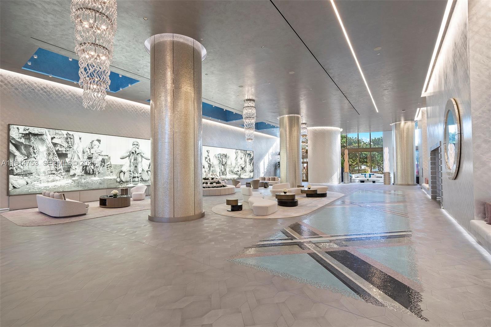 17901 Collins Avenue, Unit 4507 Sunny Isles Beach, FL 33160 - Photo 30 of 58 a lobby with furniture and large windows