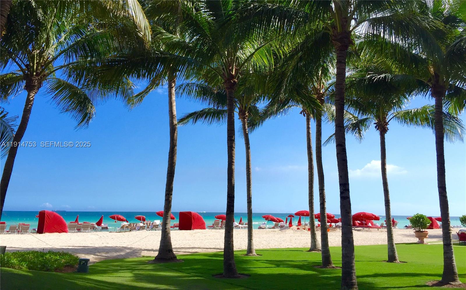 17901 Collins Avenue, Unit 4507 Sunny Isles Beach, FL 33160 - Photo 36 of 58 a view of multi story residential apartment building with a yard and palm trees