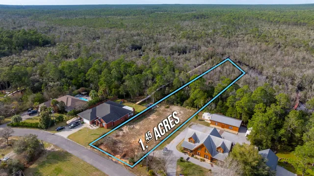 an aerial view of house with yard