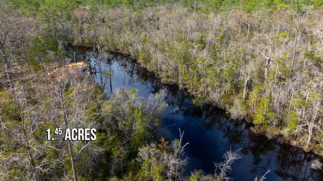 a view of sign board and green space