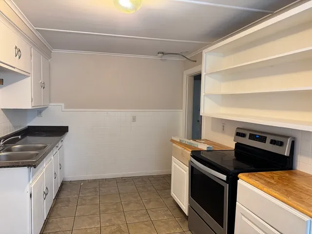 a kitchen with a stove and a refrigerator