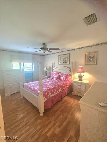 a bathroom with a double vanity sink mirror and shower