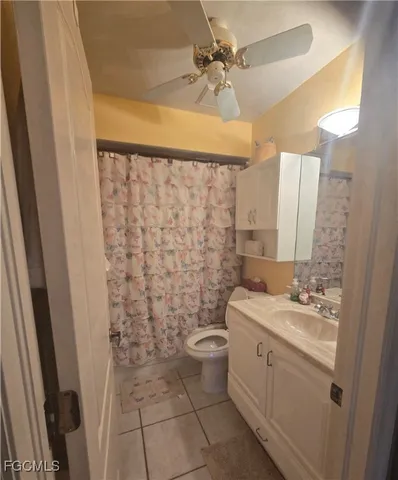 a utility room with cabinets washer and dryer