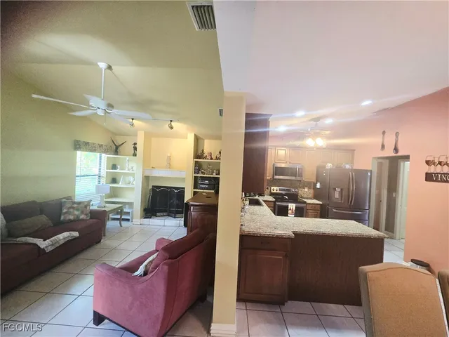 a view of a patio with a table chairs and a table