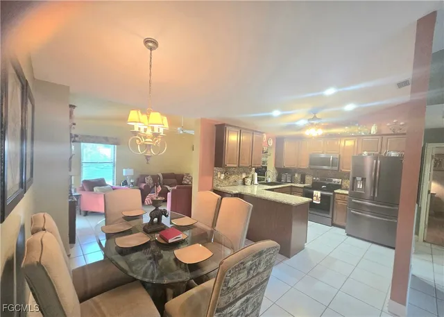 a kitchen with a sink a counter top space and appliances