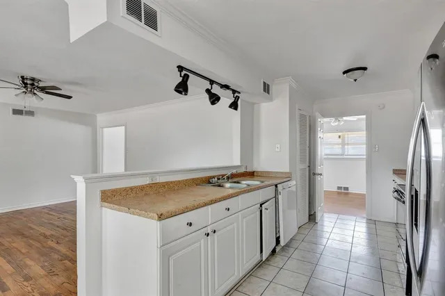 a kitchen with a stove and a refrigerator